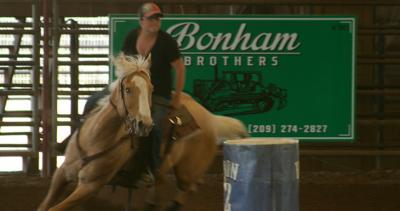 Rider on horse, Barrel Racing at the Equestrian Complex